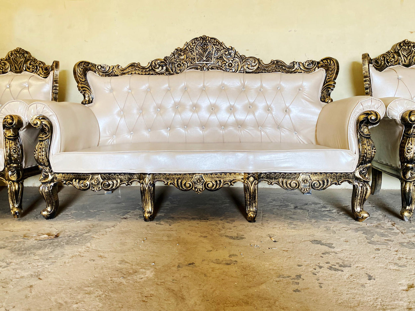 Hand Carved Louis XVI Sofa: Rustic Gold Teak, Cream Upholstery
