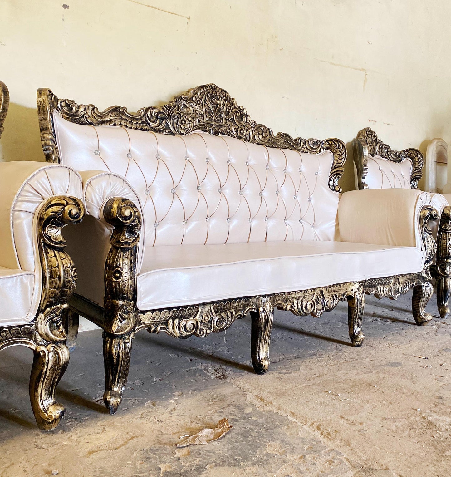 Hand Carved Louis XVI Sofa: Rustic Gold Teak, Cream Upholstery